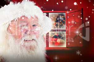 Composite image of santa claus winking