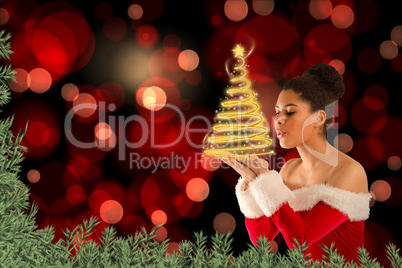 Composite image of pretty santa girl blowing over her hands