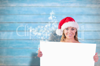 Composite image of festive blonde smiling at camera