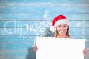 Composite image of festive blonde smiling at camera