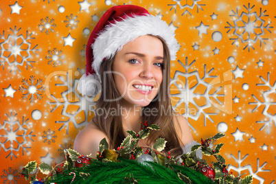 Composite image of sexy santa girl smiling at camera