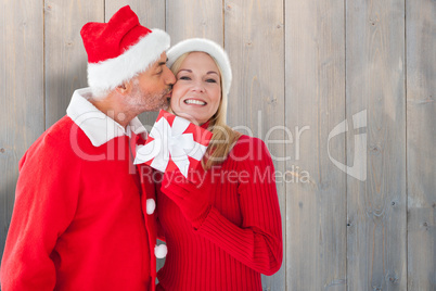 Composite image of festive couple