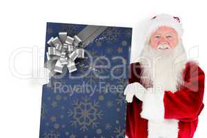 Composite image of santa claus showing blackboard