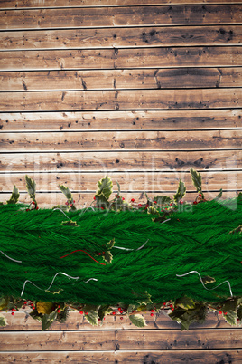 Composite image of fir branch christmas decoration garland