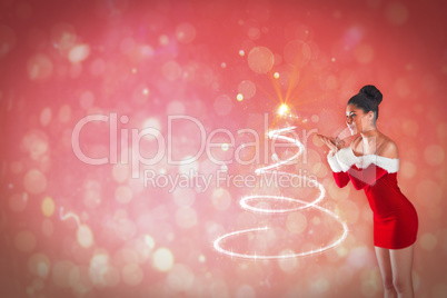 Composite image of pretty santa girl blowing over her hands