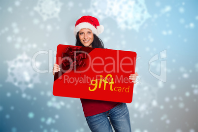 Composite image of woman holding a white sign