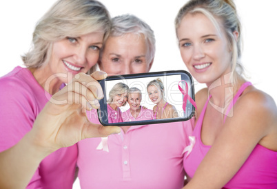 Composite image of hand holding smartphone showing Composite image of hand holding smartphone showing