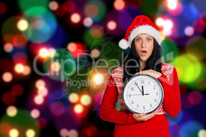 Composite image of woman shocked at the time