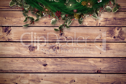 Composite image of festive christmas wreath with decorations