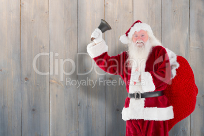 Composite image of santa claus ringing bell