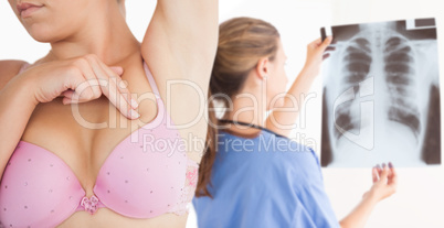 Composite image of woman performing self breast examination