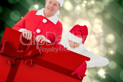 Composite image of festive couple showing poster