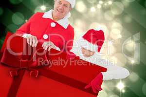 Composite image of festive couple showing poster