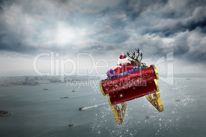 Composite image of santa flying his sleigh