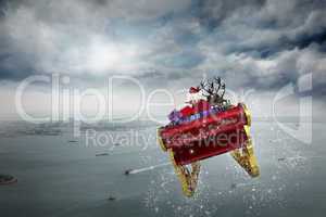 Composite image of santa flying his sleigh