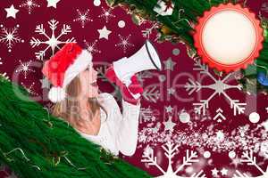 Composite image of festive blonde shouting through megaphone