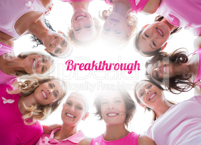 Group of happy women in circle wearing pink for breast cancer