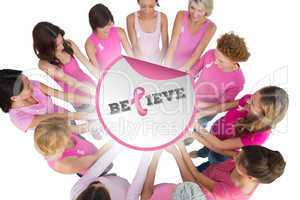 Composite image of cheerful women joined in a circle and looking