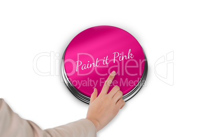 Hand pressing pink button for breast cancer awareness