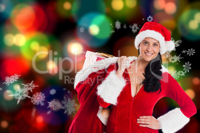 Composite image of woman smiling with christmas presents
