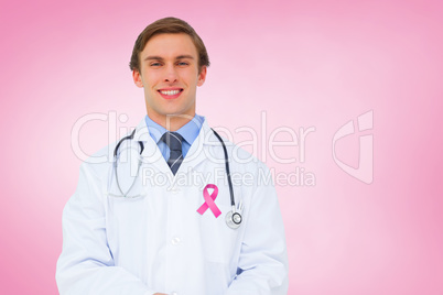 Composite image of young doctor using tablet pc