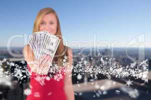 Composite image of pretty blonde showing wad of cash
