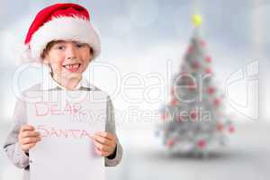 Composite image of festive boy showing letter
