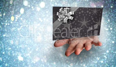 Composite image of hand bursting through paper