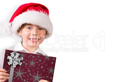 Composite image of festive boy showing letter