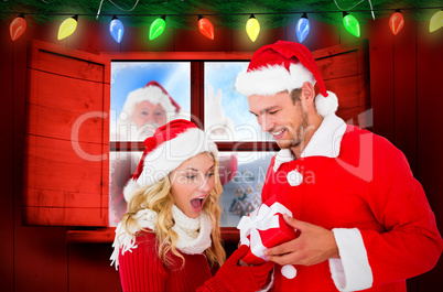 Composite image of young festive couple