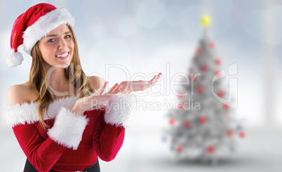 Composite image of sexy santa girl presenting with hands