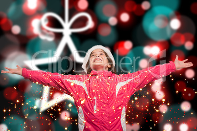 Composite image of cute girl in winter clothes with arms out