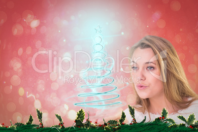 Composite image of pretty blonde blowing a kiss