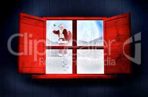 Composite image of santa delivery presents to village