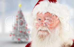 Composite image of santa claus winking