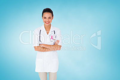 Composite image of pretty nurse with arms crossed