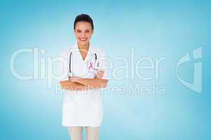 Composite image of pretty nurse with arms crossed