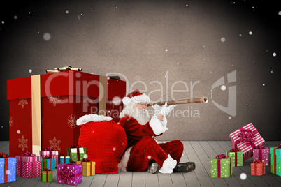 Composite image of santa looking through a telescope