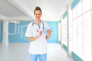 Composite image of pretty nurse using tablet pc