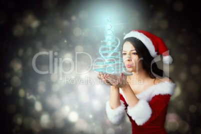 Composite image of pretty girl in santa outfit blowing