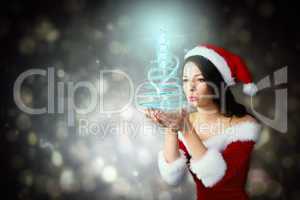 Composite image of pretty girl in santa outfit blowing