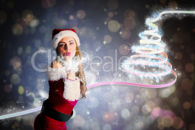 Composite image of sexy santa girl blowing a kiss