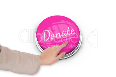 Hand pressing pink button for breast cancer awareness