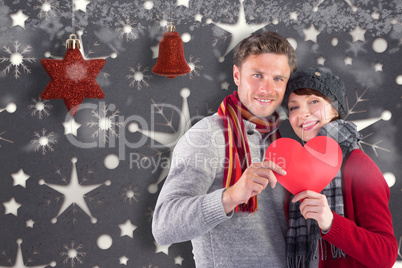 Composite image of smiling woman holding christmas presents