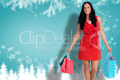 Composite image of woman standing with shopping bags