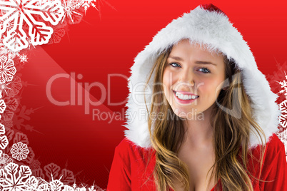 Composite image of sexy santa girl smiling at camera