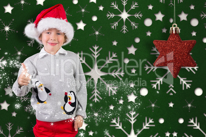 Festive and smiling boy giving a thumbs up