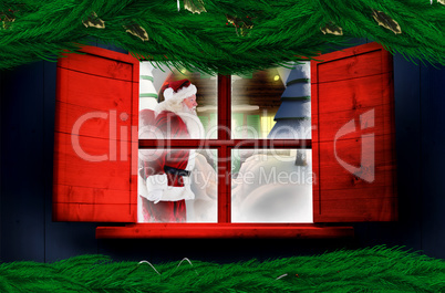 Composite image of santa delivery presents to village