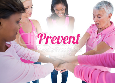 Women wearing pink and ribbons for breast cancer putting hands t