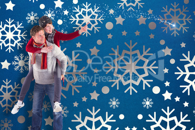 Composite image of man giving girlfriend piggy back